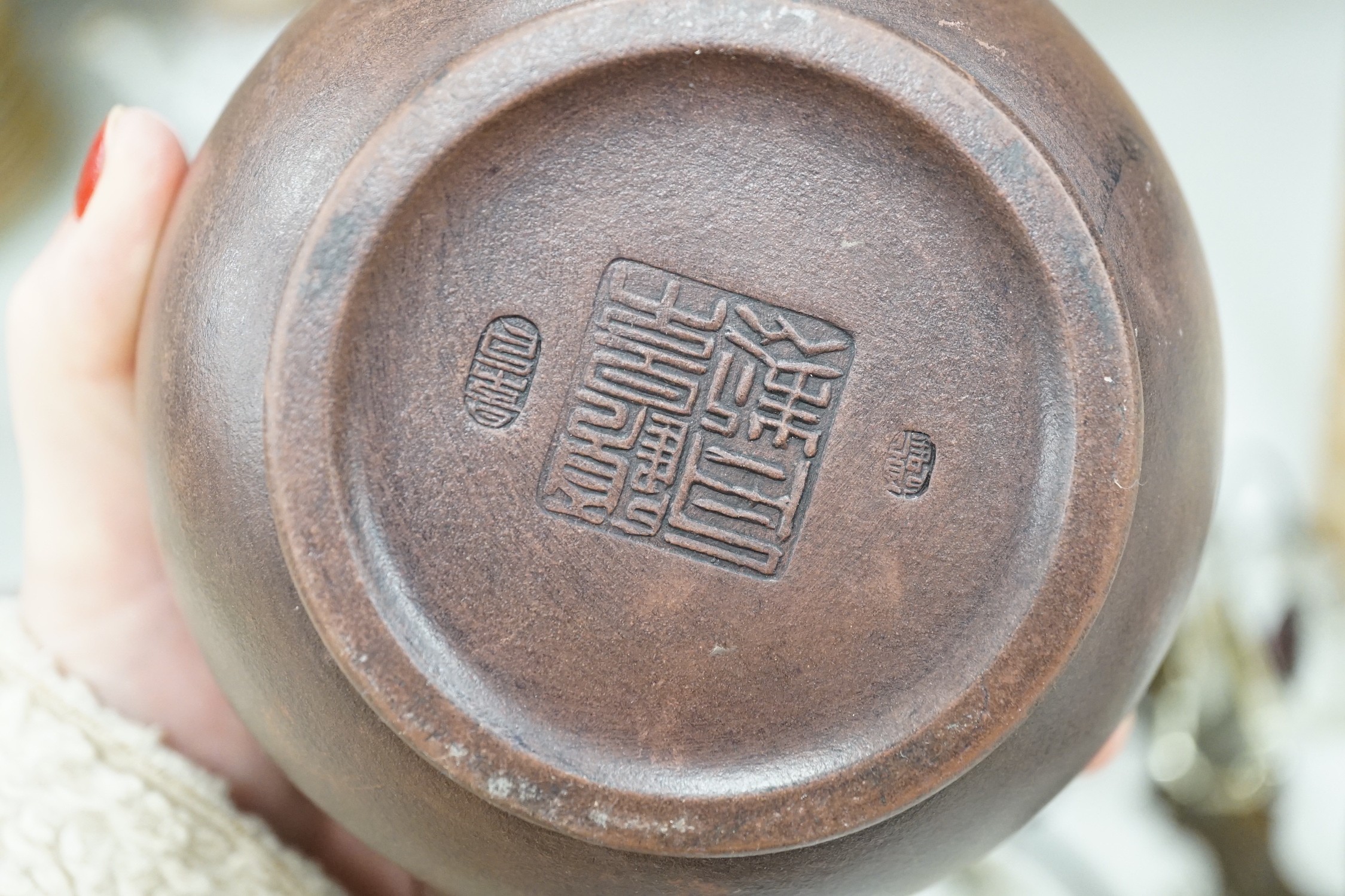 A quantity of Chinese Yixing teapots, a cinnabar resin jar and cover, a Samson teapot etc.